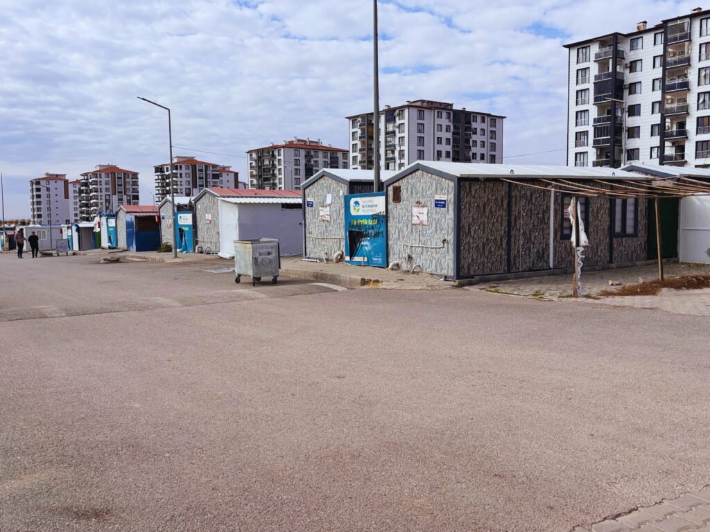 4- Post-earthquake Adıyaman temporary life continues in the container city on one side, while new housing rises on the other